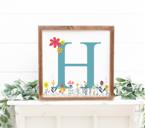 A flower initial sign